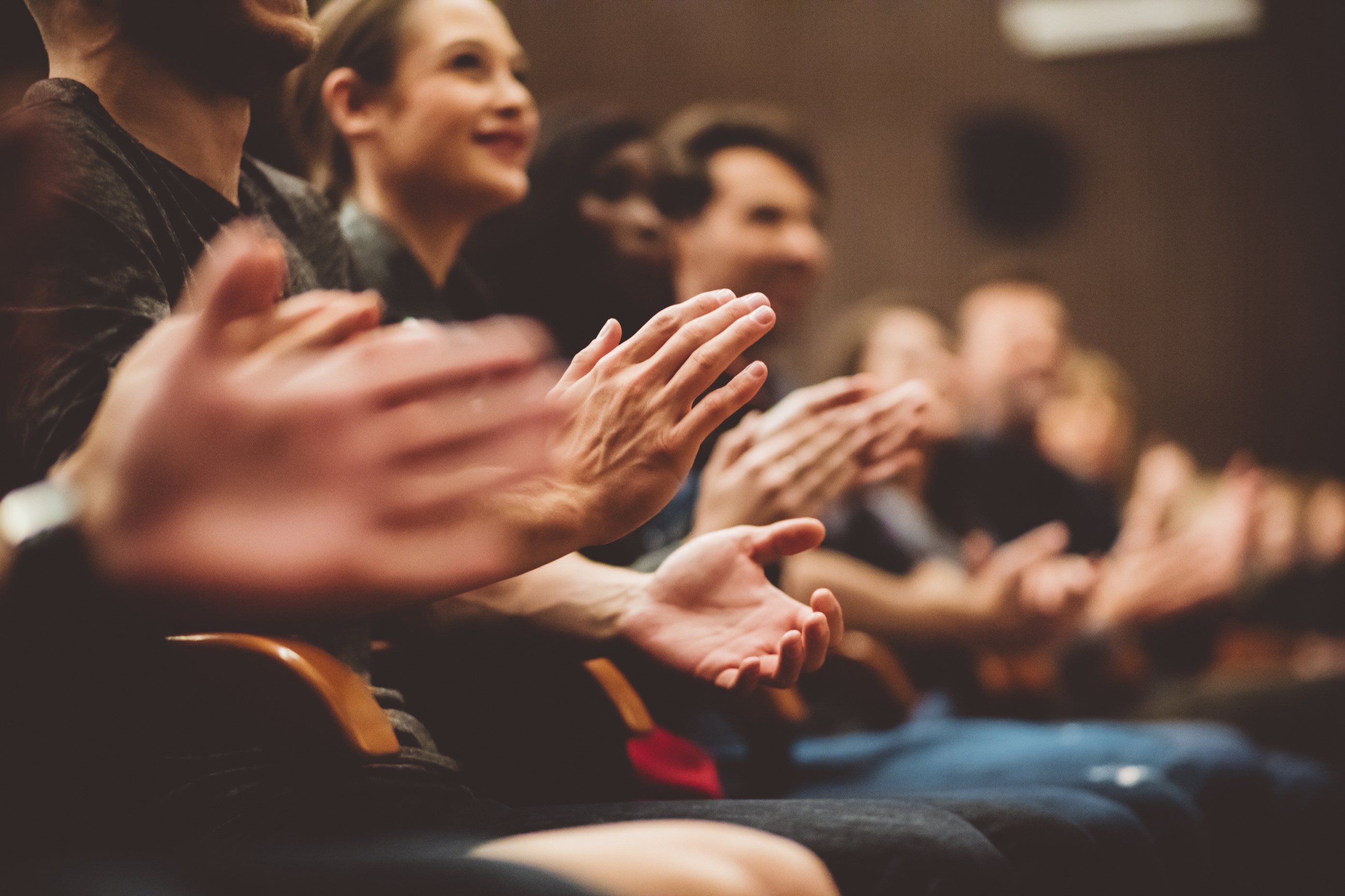 People applauding in the theater